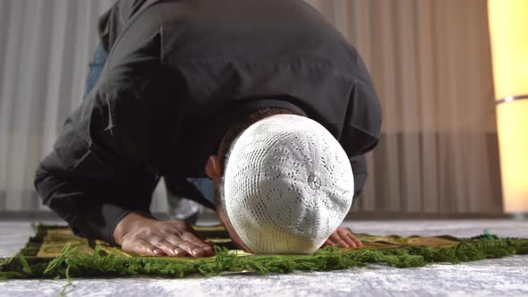 Man prostrating in islam.