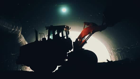 Excavator Working Inside A Tunnel