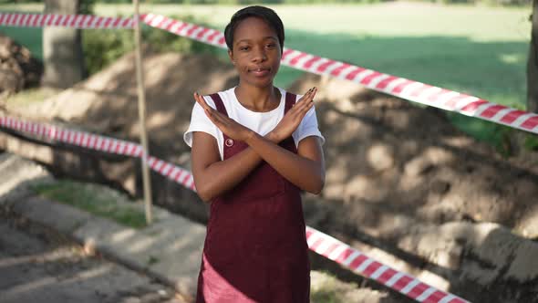 Serious African American Eco Activist Crossing Hands Gesturing No in Slow Motion Looking at Camera