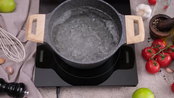 Water Boiling in a Pot on Induction Hob at Domestic Kitchen