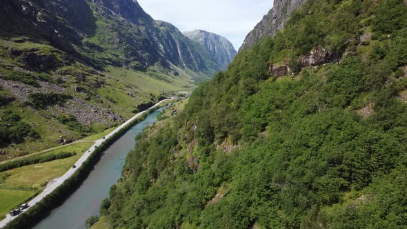 Tourists are traveling through mountain valley to reach northern Norway - Stardalen E-39 Norway aeri
