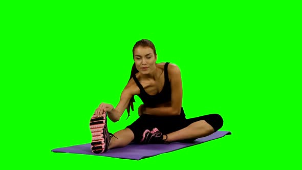 Woman Practicing Yoga in Gym, Stretching, Green Screen