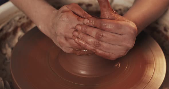 Potter Makes Pottery From Clay Close Up. Making Ceramic Products From Red Clay. Twisted Potter's