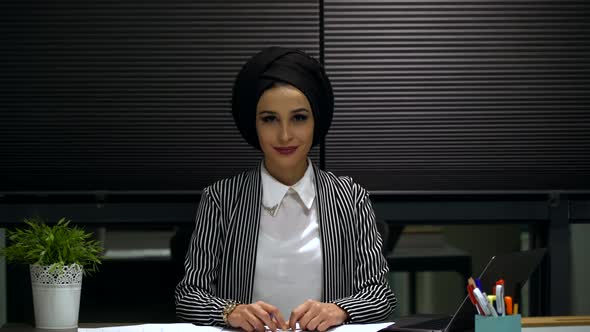 Muslim Businesswoman Looking at Camera