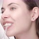 Woman with Nude Makeup Cleaning Teeth with Irrigator  - VideoHive Item for Sale