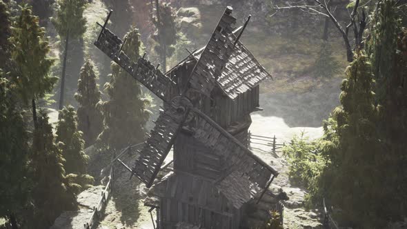 Old Traditional Wooden Windmill in the Forest alt