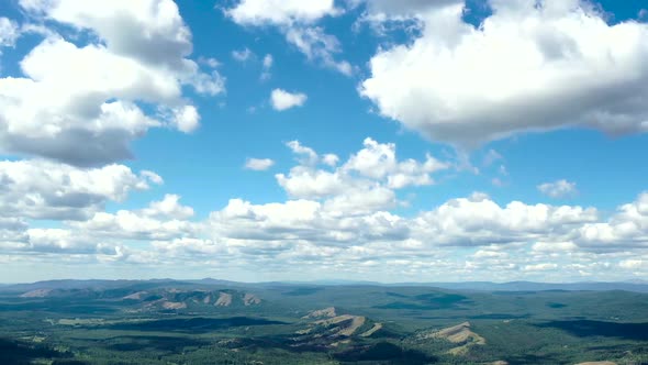 Running Clouds on the Sky, Sadows Running By Hills. Time Lapse.