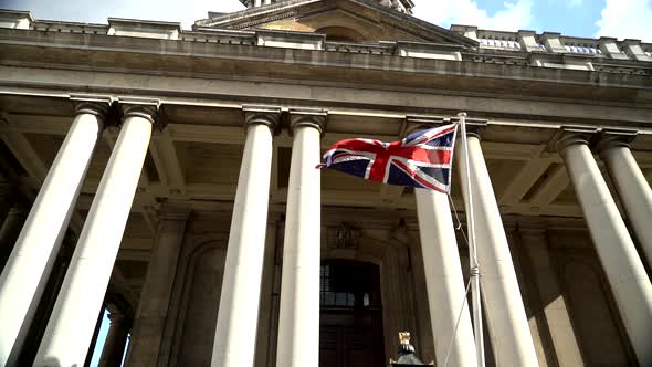 The UK Flag in the wind in slow motion on a colonial building in Greenwich, London City.  120fps