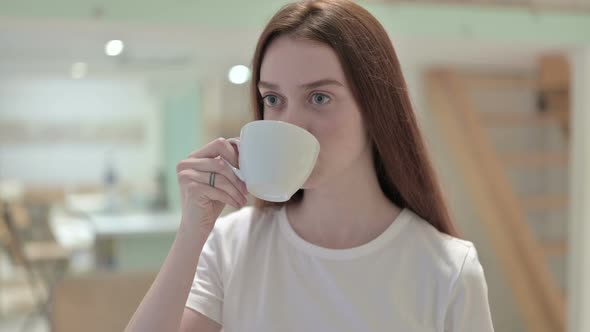 Portrait of Redhead Young Woman Having Toothache By Drinking Cold