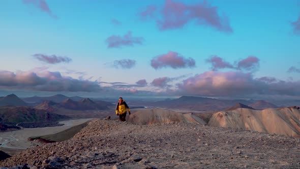 A Man with a Backpack Travels at Landmannalaugar Nature Landscape