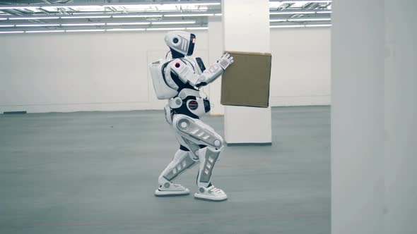 White Robot Carries a Box, Side View