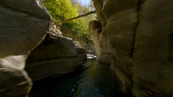 FPV Drone Extreme Flying Natural Mountain River Water Splash Surrounded By Stones