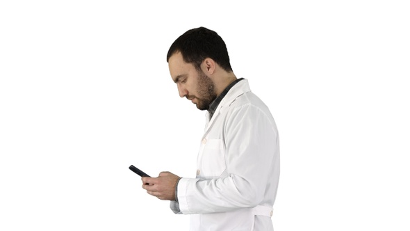 Walking Doctor or Nurse Texting on A Cell Phone on White