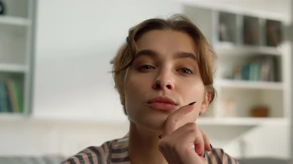 Pensive Millennial Girl Looking Webcam Closeup