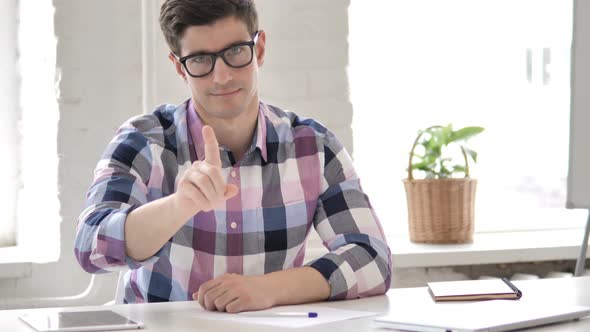 No by Young Man in Office Looking at Camera, Denial