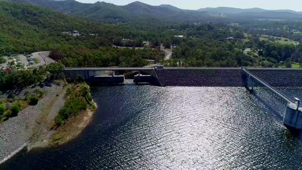 Dam reservoir with mountains in background