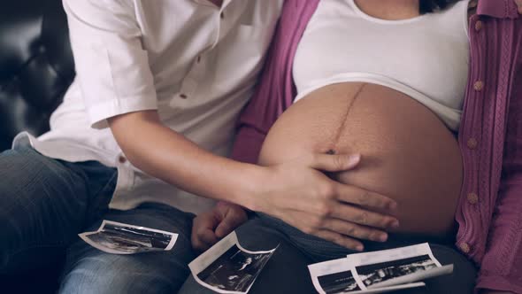 Pregnant Couple Feels Love and Relax at Home