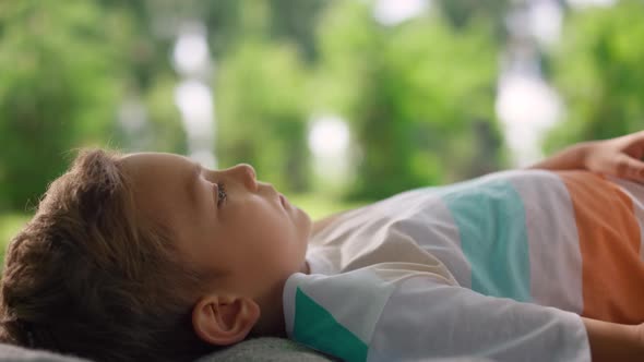 Relaxed Guy Lying on Blanket Closeup