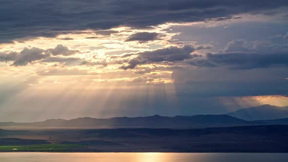 Sun rays shining through the clouds during timelapse in Utah