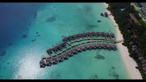 Aerial landscape of marine coast beach time by aqua blue water and white sand background of a dayout