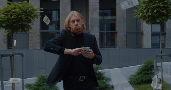 Portarit of Handsome Businessman with Long Hair Dancing and Rejoicing While Standing at Street. Man