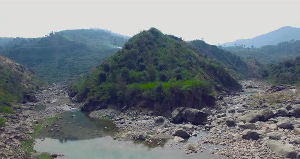 A curve in mountains with river.