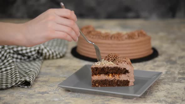 Piece of Delicious Chocolate Cake with nuts and caramel.	