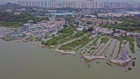 A dynamic wide aerial footage of the fishing village in Lau Fau Shan in the New Territories of Hong