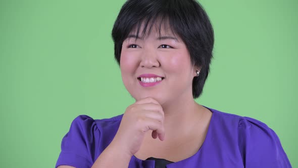 Face of Happy Young Beautiful Overweight Asian Woman Thinking and Looking Up