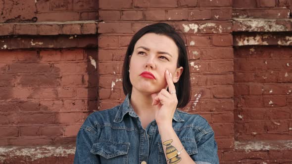 Suspicious woman listening, doubtingand thinking. Ponder and make a decision