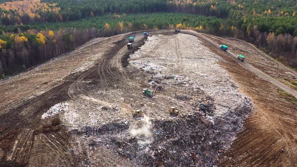 Large Landfill with Garbage Trucks, Top View.