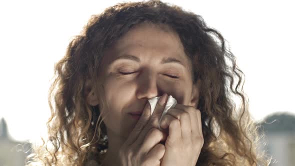 Portrait of a Sick Woman with Symptoms of Flu Cold or Coronavirus