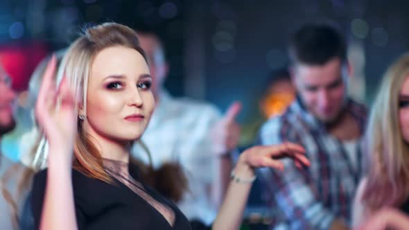 Beautiful Woman is Dancing at a Party