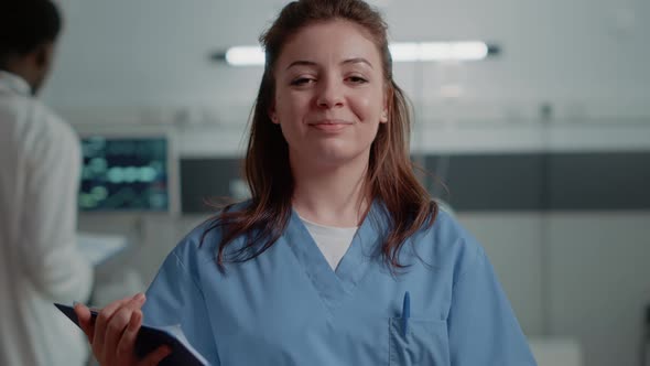 Close Up of Medical Assistant Standing in Hospital Ward