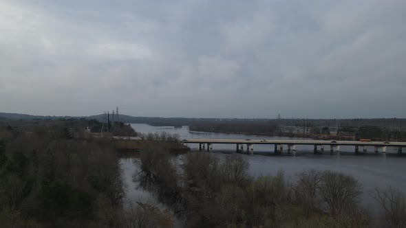 A view of cars passing the bridge over a river in Menomonie, Wisconsin in 4K