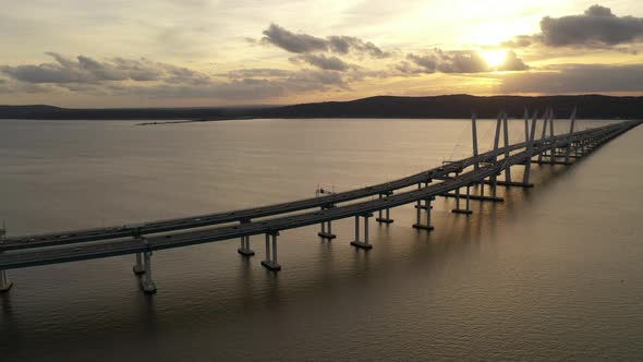 An aerial shot of the Mario M. Cuomo Bridge taken on the north side. The drone camera dolly out & bo