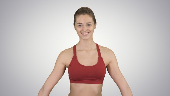 Young attractive woman practicing yoga sitting in Gomukasana