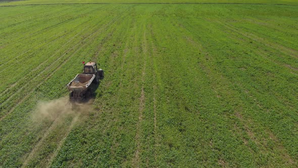 Aerial Tractor Spreads Fertilizer