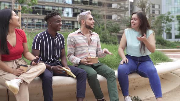 Group of Young Multi Ethnic Colleague Friends Enjoying Conversation While Eating Take Out Street