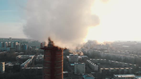 Industrial Concept - Smoke Coming Out of a Manufacturing Pipe - Atmospheric Pollution of an Air in