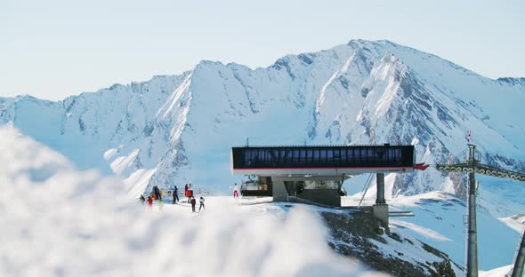 Brand new ski lift, chair lift mountain top station in a famous ski resort in the austrian alps. Cha