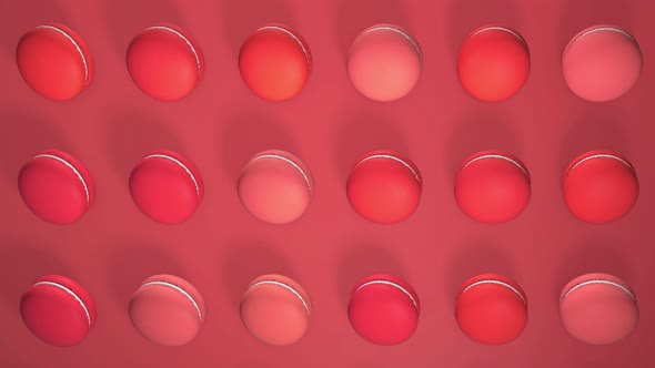 Red macaron pastries on light paper background