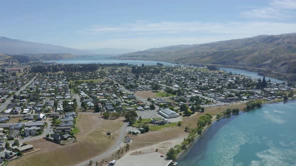 Overhead drone drifting across Cromwell by the lake in Central Otago