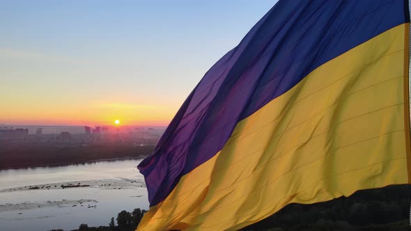 Ukrainian Flag in the Morning at Dawn. Aerial. Kyiv. Ukraine