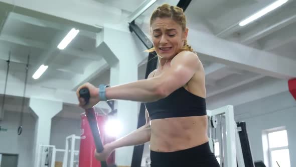 Girl Beats with a Hammer in Training