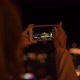 Young Woman Makes Photo of Local Square with City Lights - VideoHive Item for Sale