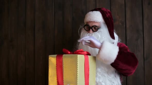 Santa Claus gives you a golden gift box