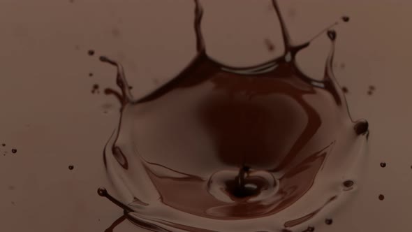 Super Slow Motion Detail Shot of Melted Chocolate Crown Splash at 1000 Fps