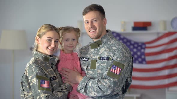 Happy American Military Couple With Child Smiling on Camera, Patriotic Family