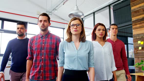 Business executives walking together in office